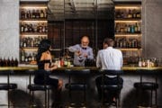Bartender pouring cocktail at City Hall Bar