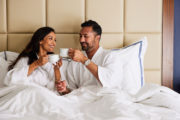 A couple having coffee in bed