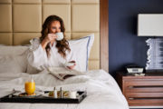 A woman having breakfast in bed.