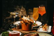 food, wine and cocktails on a table