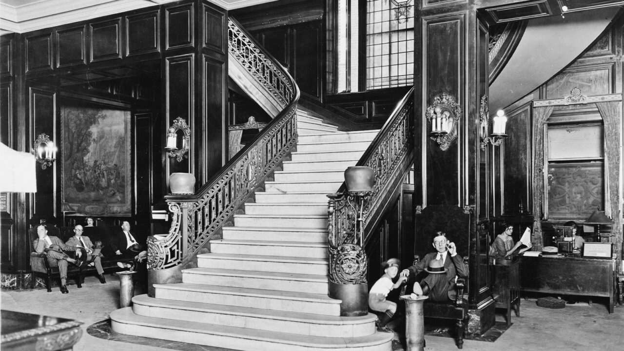 Black and white photo of The Adolphus staircase in 1920s